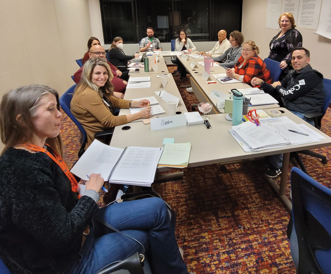 photo of small group session members sitting around a table