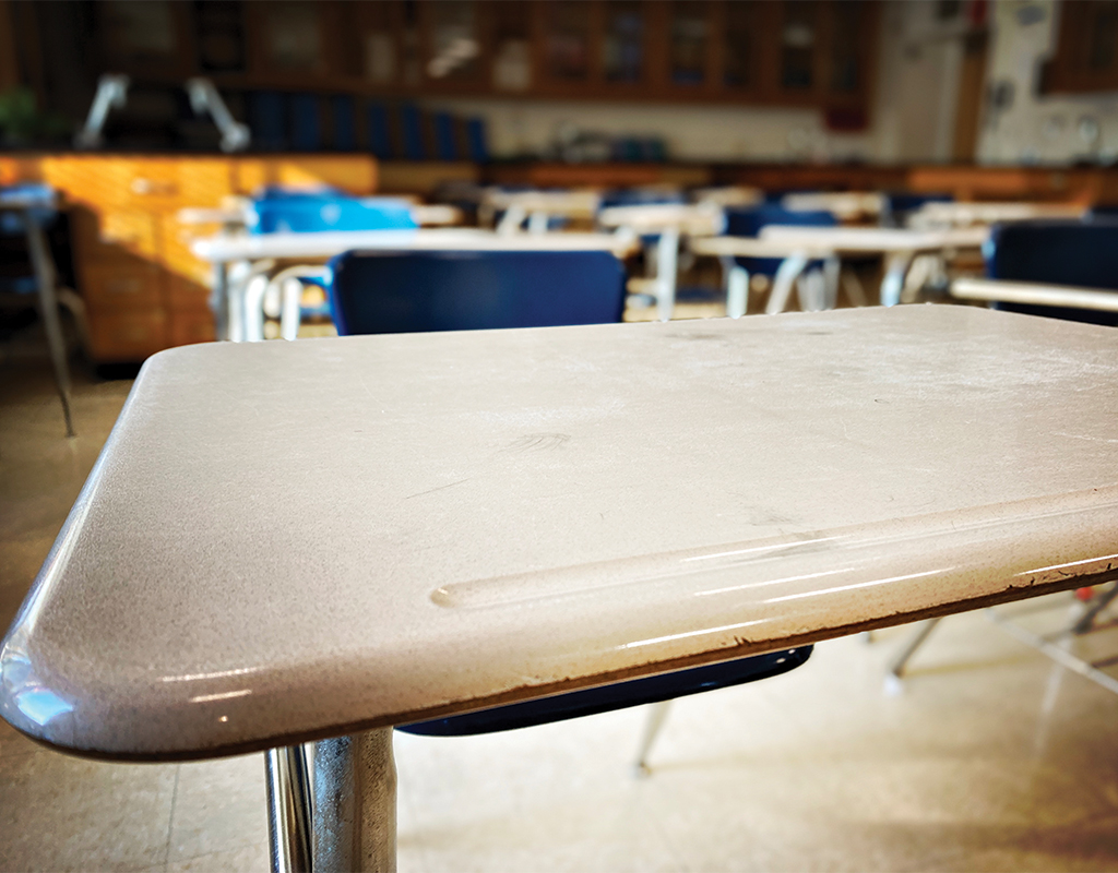 photo of a desk in an empty classroom