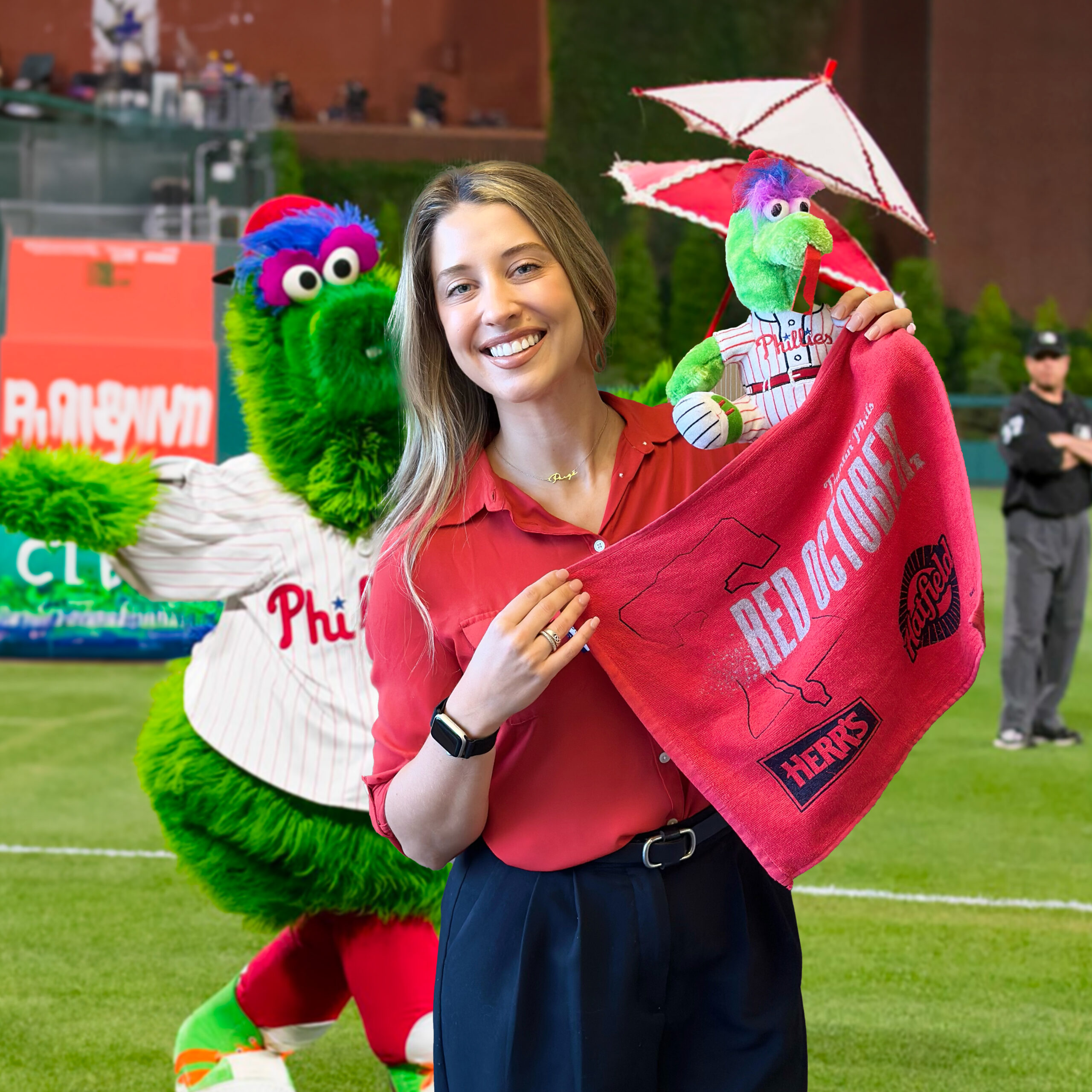 Paige Beierschmitt with Phillie Phanatic mascot behind her