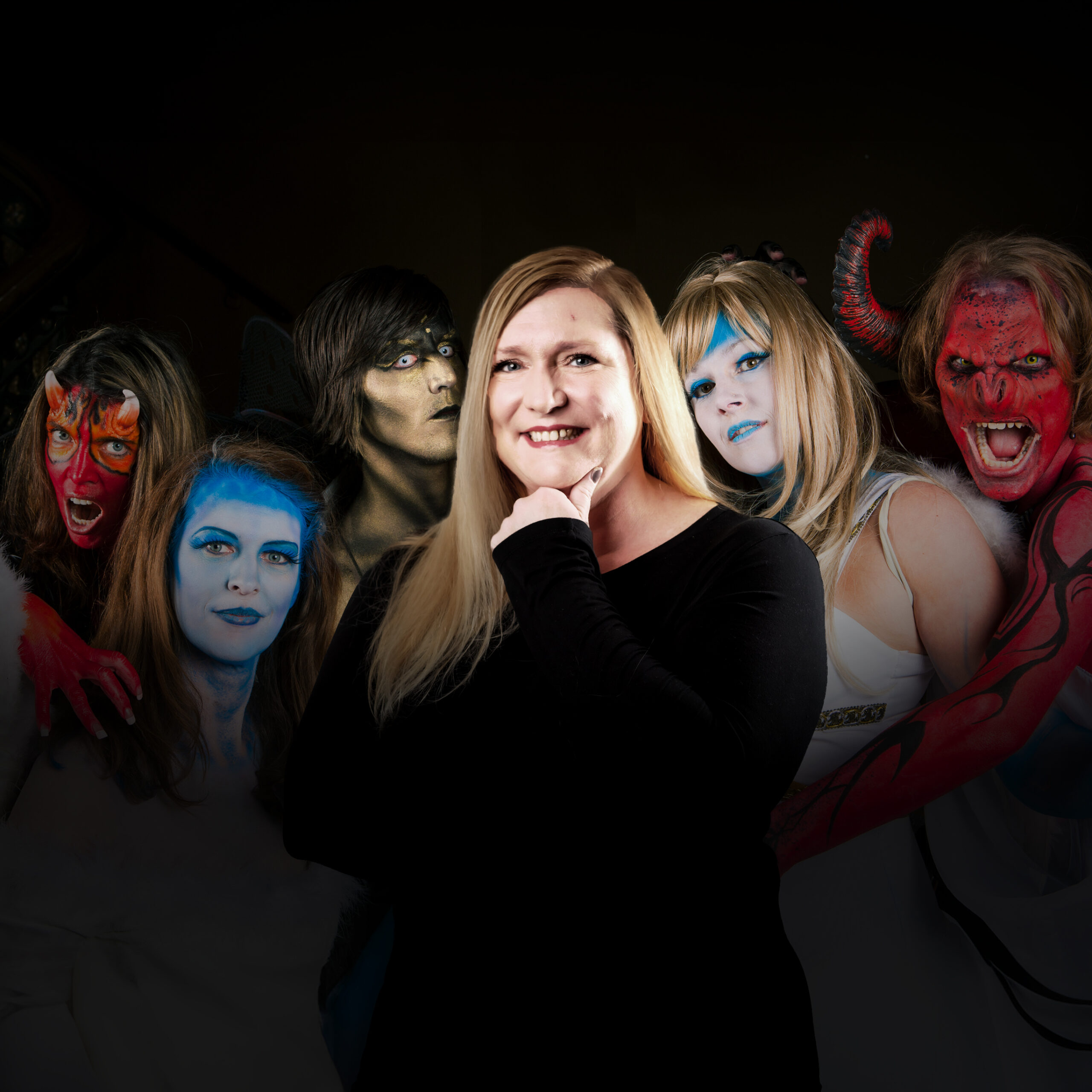 Amy Burke with theatrical demons behind her