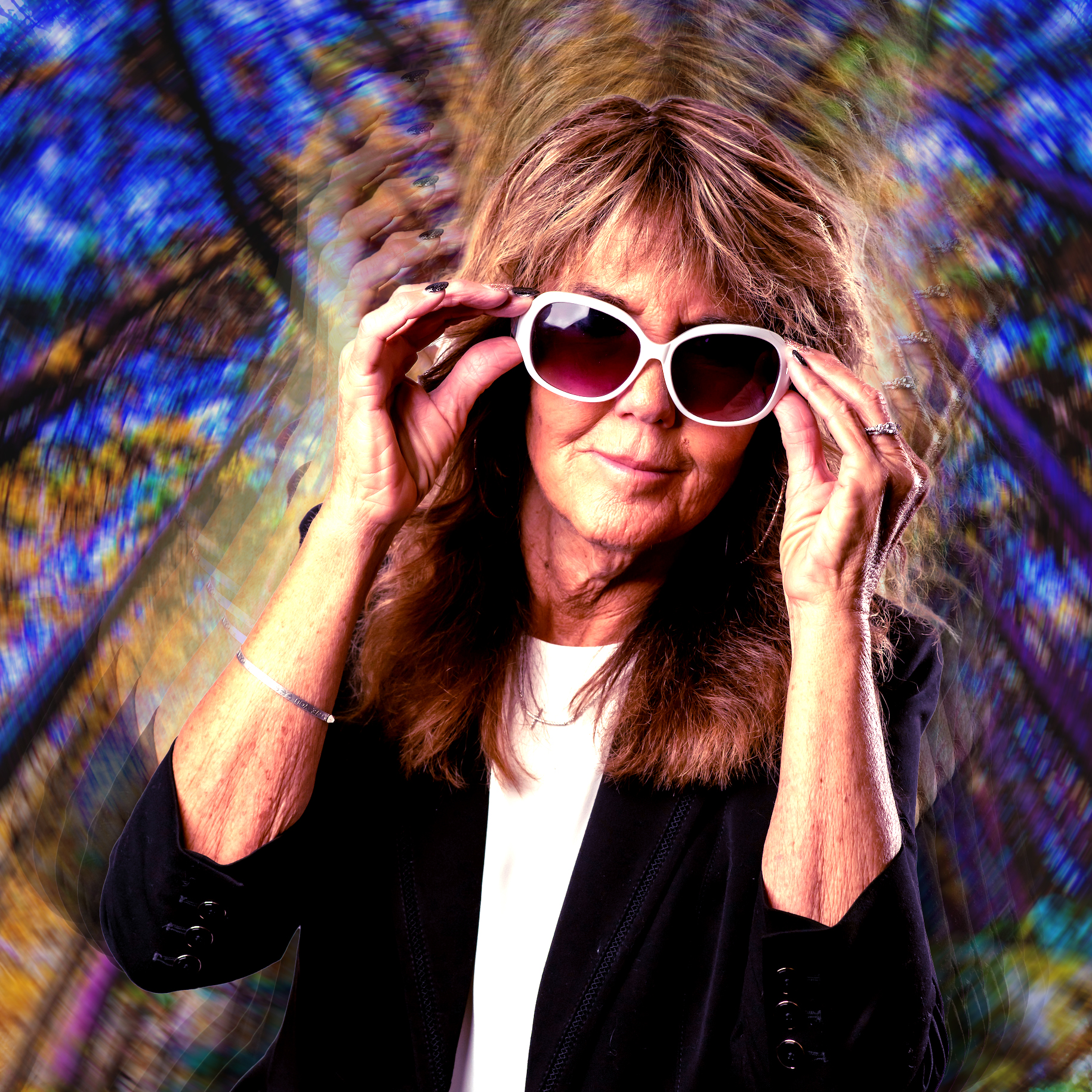 Cynthia (Harrison) Aloi in front of psychedelic background