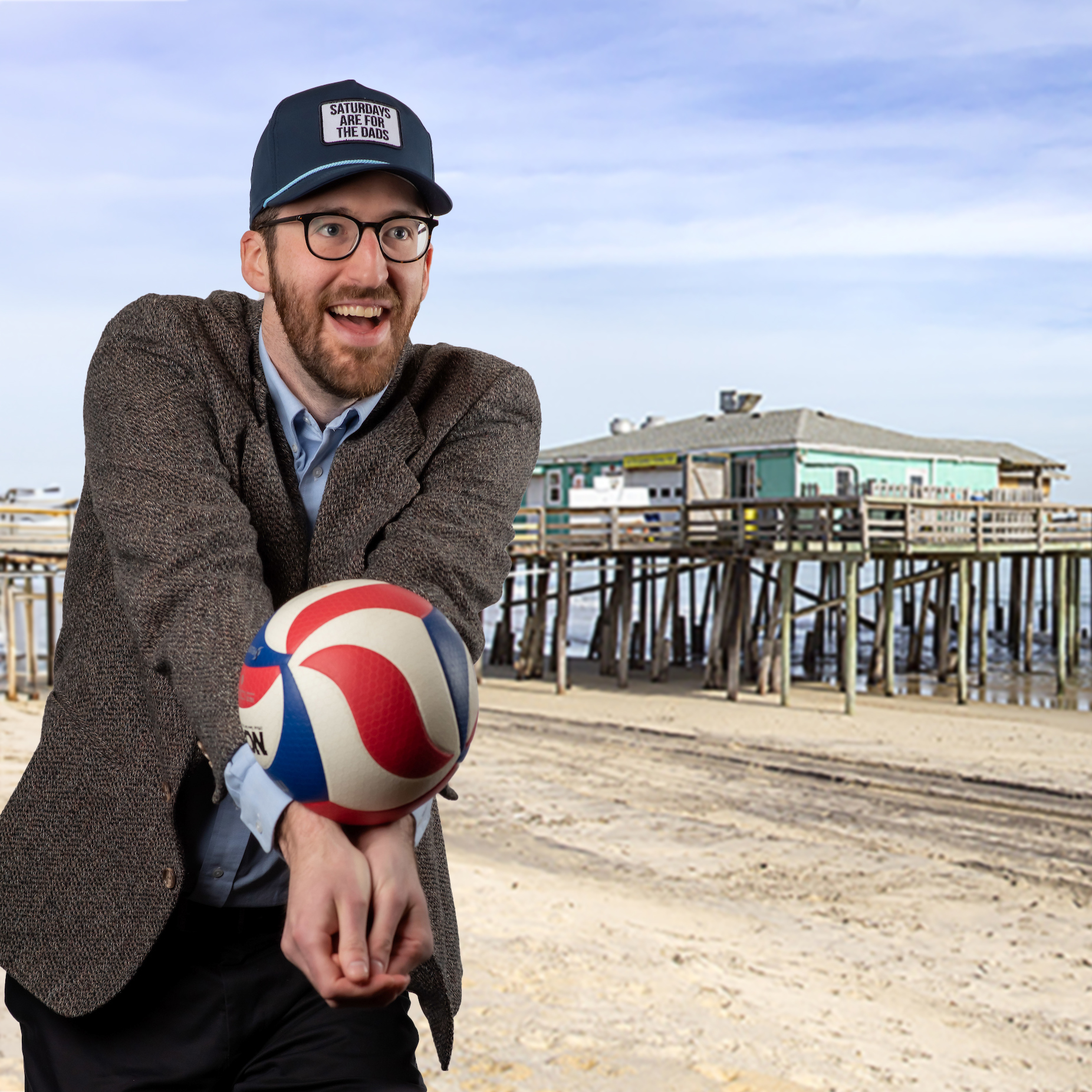 Michael Kvidahl fun photo serving a volleyball with with the beach in the Outer Banks in the background