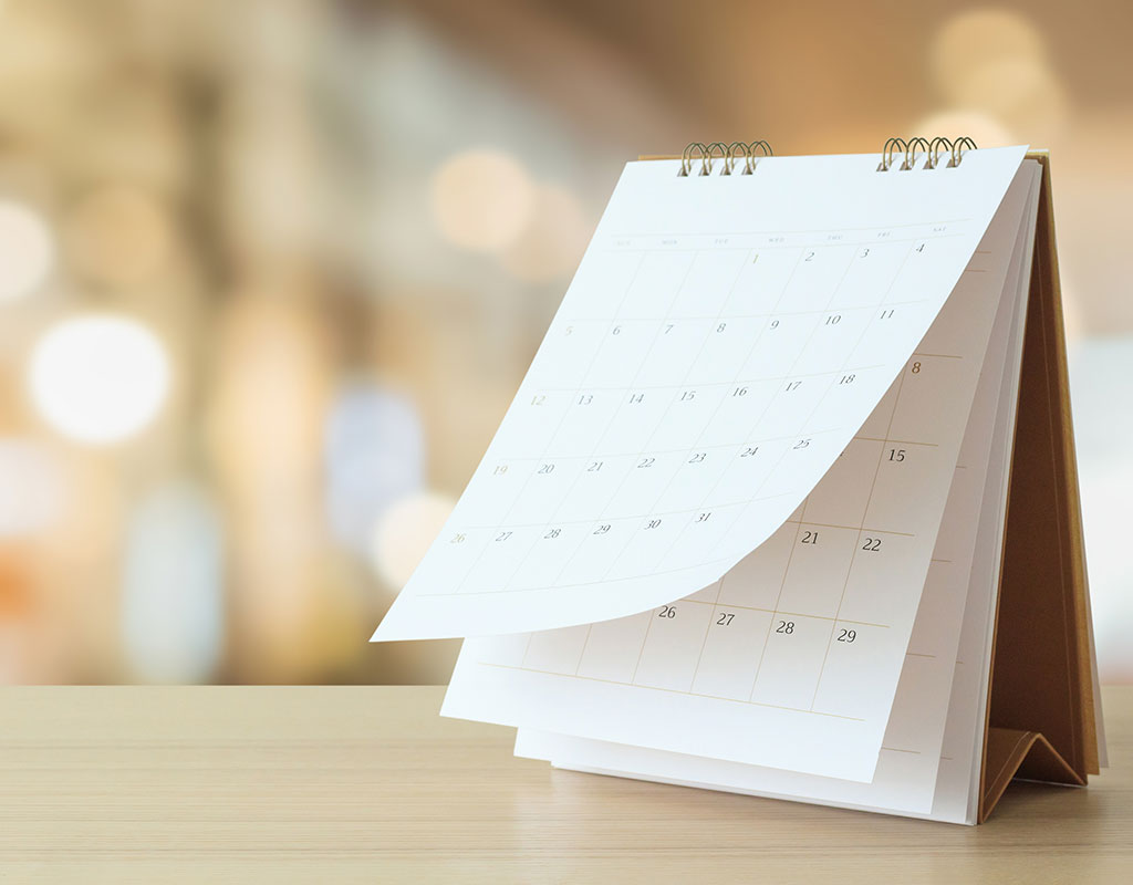 standing calendar on a table with the background out of focus