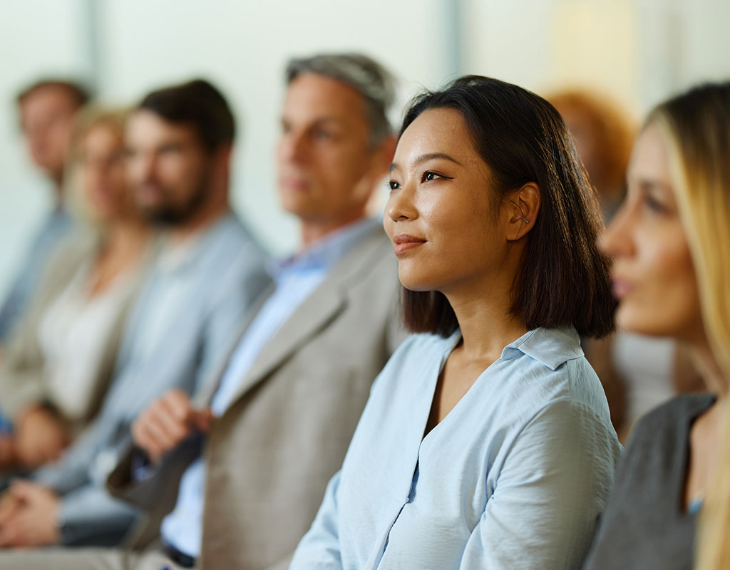 adult professionals sitting in a training